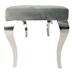 Side view of grey velvet dining bench showing structure, padding and chrome detailing at Solid Furniture UK