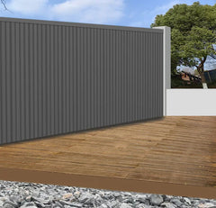 Grey WPC outdoor wall panels 180cm and 290cm installed in a modern UK garden setting by Solid Furniture LTD, showcasing sleek and durable exterior wall design