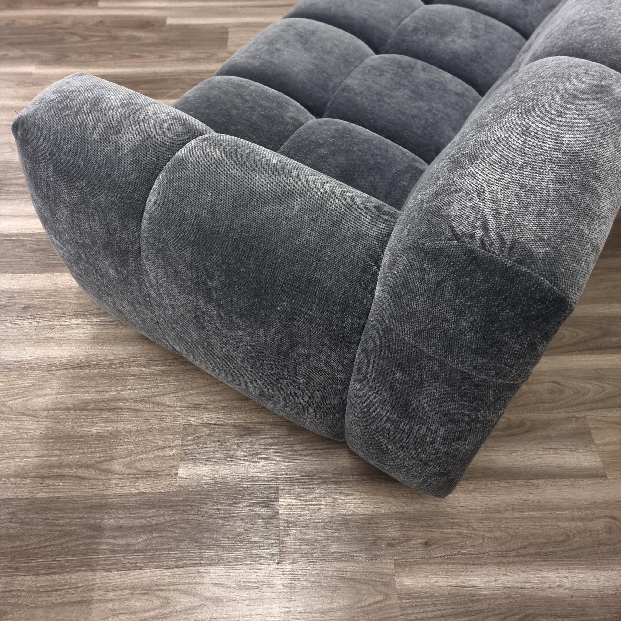 Harlem 3 seater sofa in steel velvet angled view showing full silhouette, deep cushions and elegant channel stitching, luxury UK sofa set solid Furniture UK