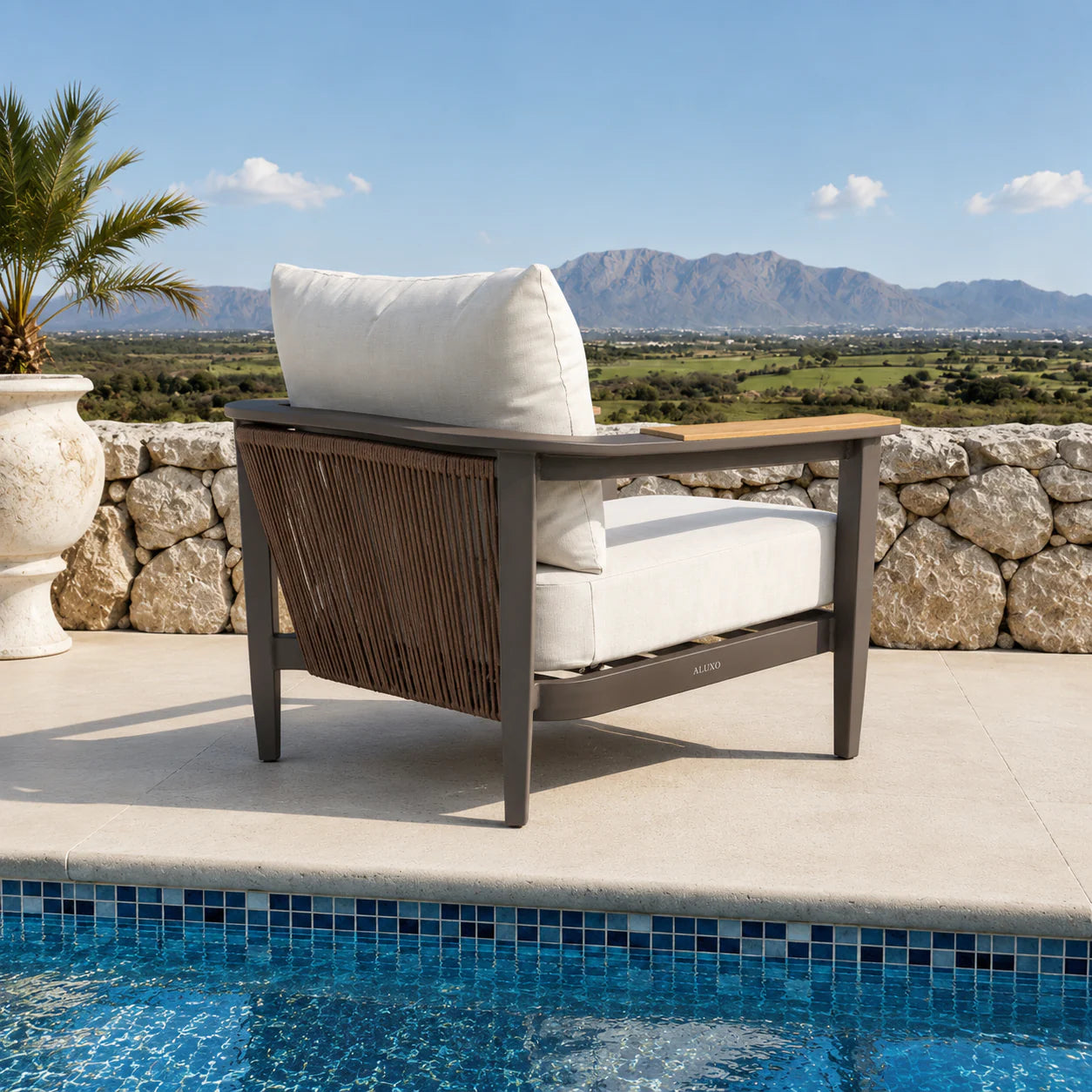 Hemera Wood outdoor garden lounge chair back side view, truffle aluminium frame with woven detail and cushioned seating for modern garden furniture set solid furniture UK