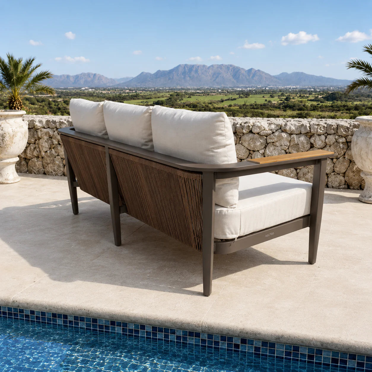 Hemera Wood outdoor garden lounge 3-seater sofa side angle view, modern wood-effect aluminium frame with deep cushions for stylish patio seating solid furniture UK