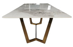 Jessica dining table side angle showing the gold geometric base and ceramic top, Solid Furniture UK