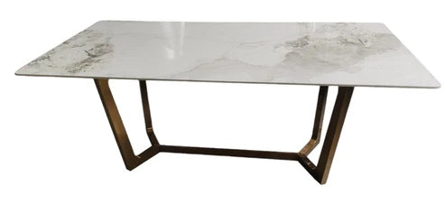 Jessica dining table side view showing its gold frame and ceramic tabletop, Solid Furniture UK