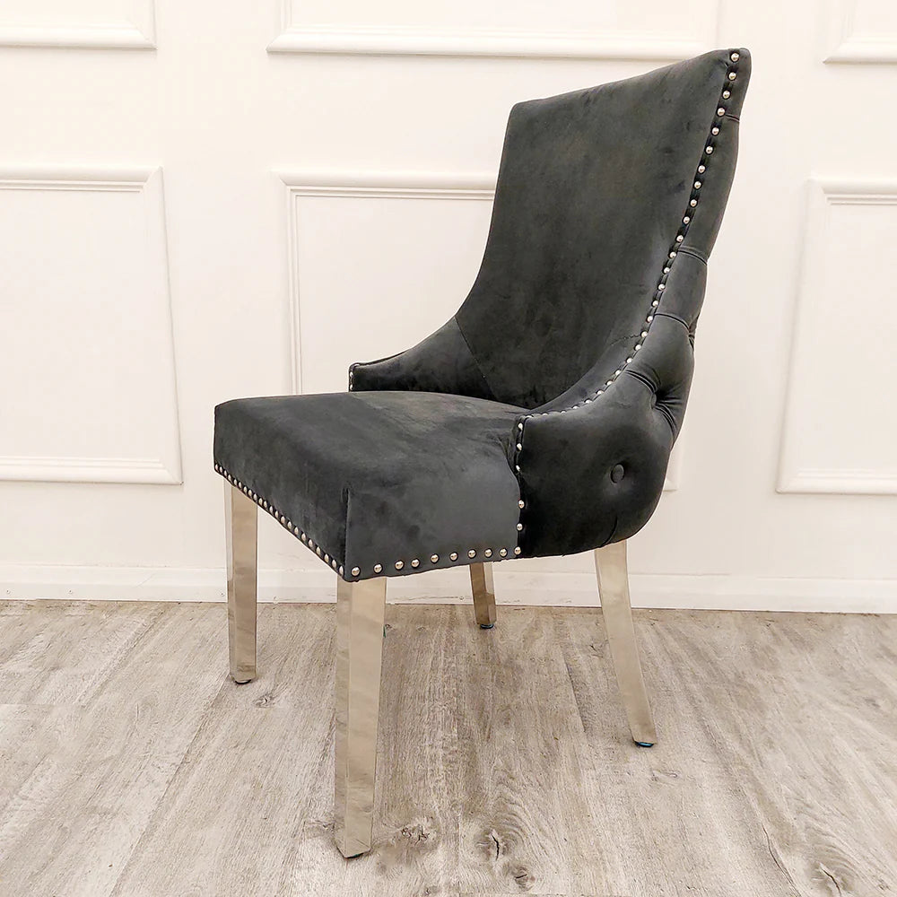 Side view of Kensington dark grey fabric dining chair showing chrome legs and elegant stud detailing UK