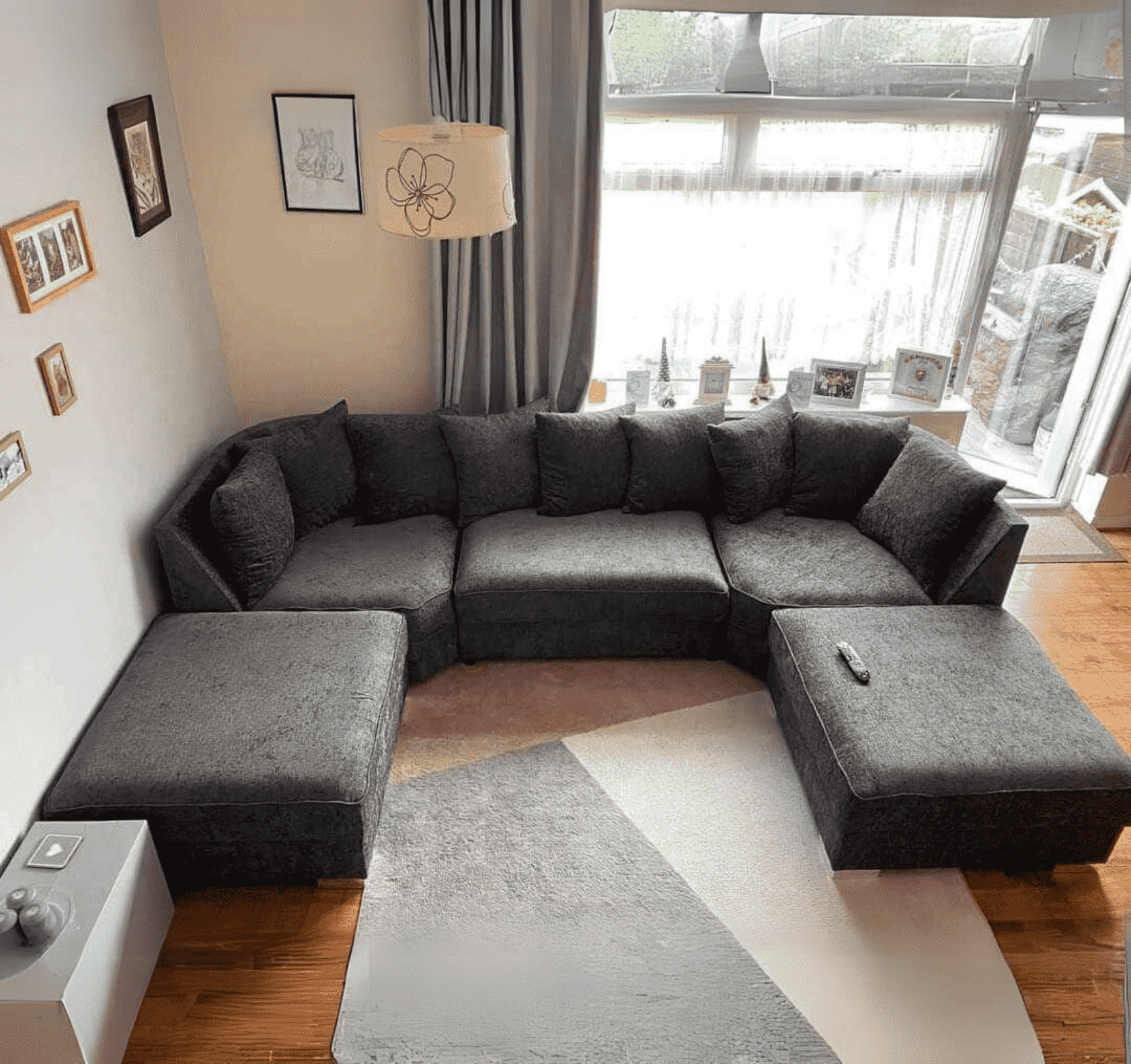 Angle view of Large Bishop U shape corner sofa in black plush velvet highlighting its modern U shape design SOLID FURNITURE LTD