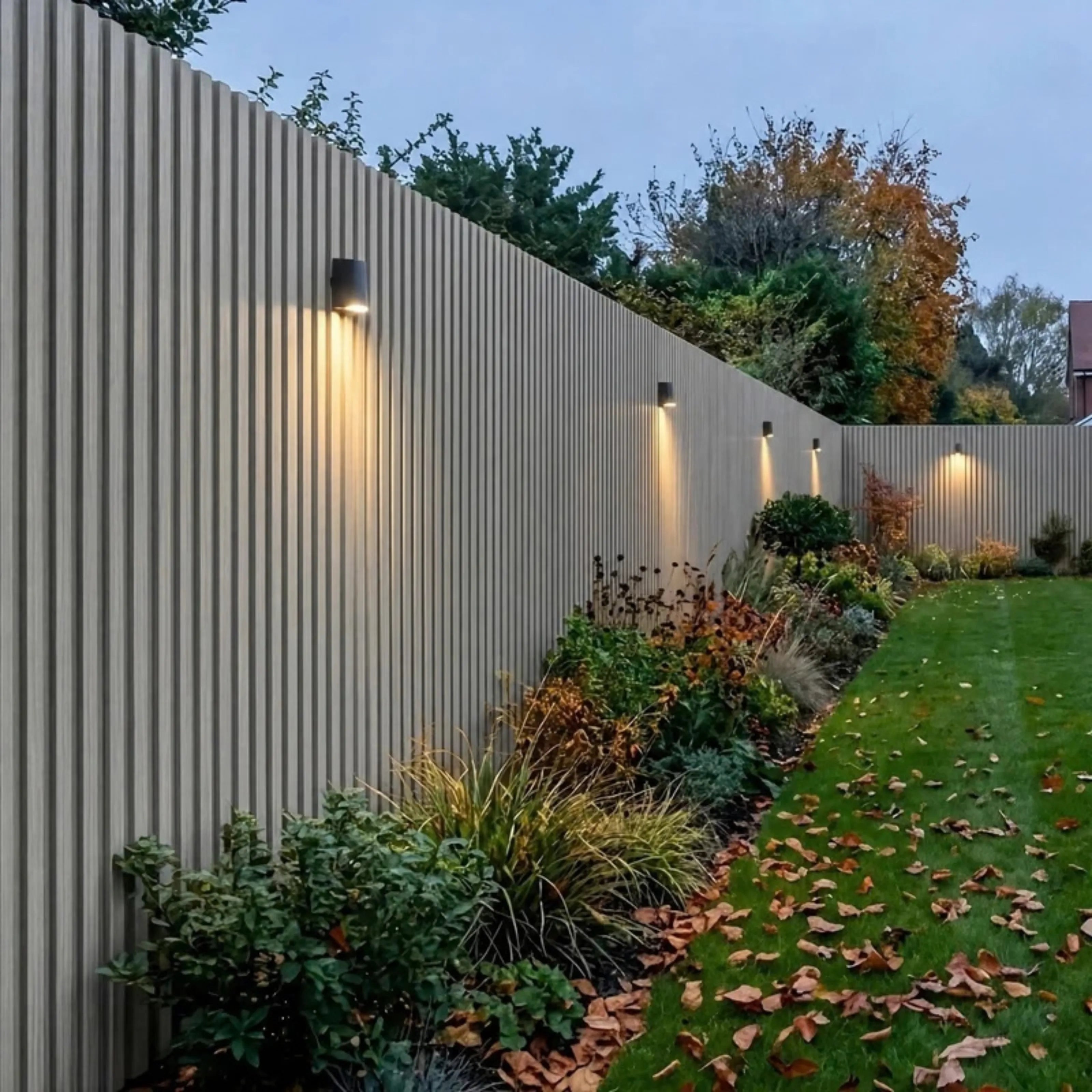 Light grey seamless waterproof WPC wall panels 15×240cm pack of 16 installed in a garden by Solid Furniture UK