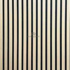 Close-up of real wood light oak acoustic wall panel showing slat spacing, wood grain texture, and acoustic felt backing.