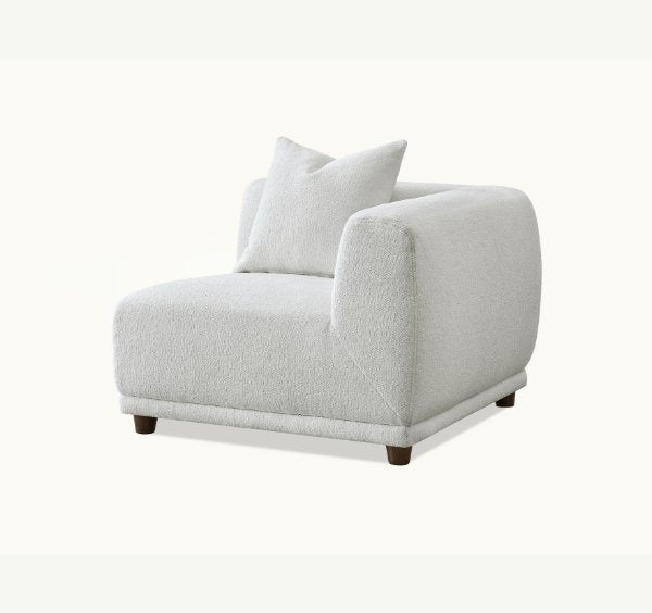 Family relaxing on Lottie modular corner sofa in Polar Bouclé - SOLID FURNITURE LTD