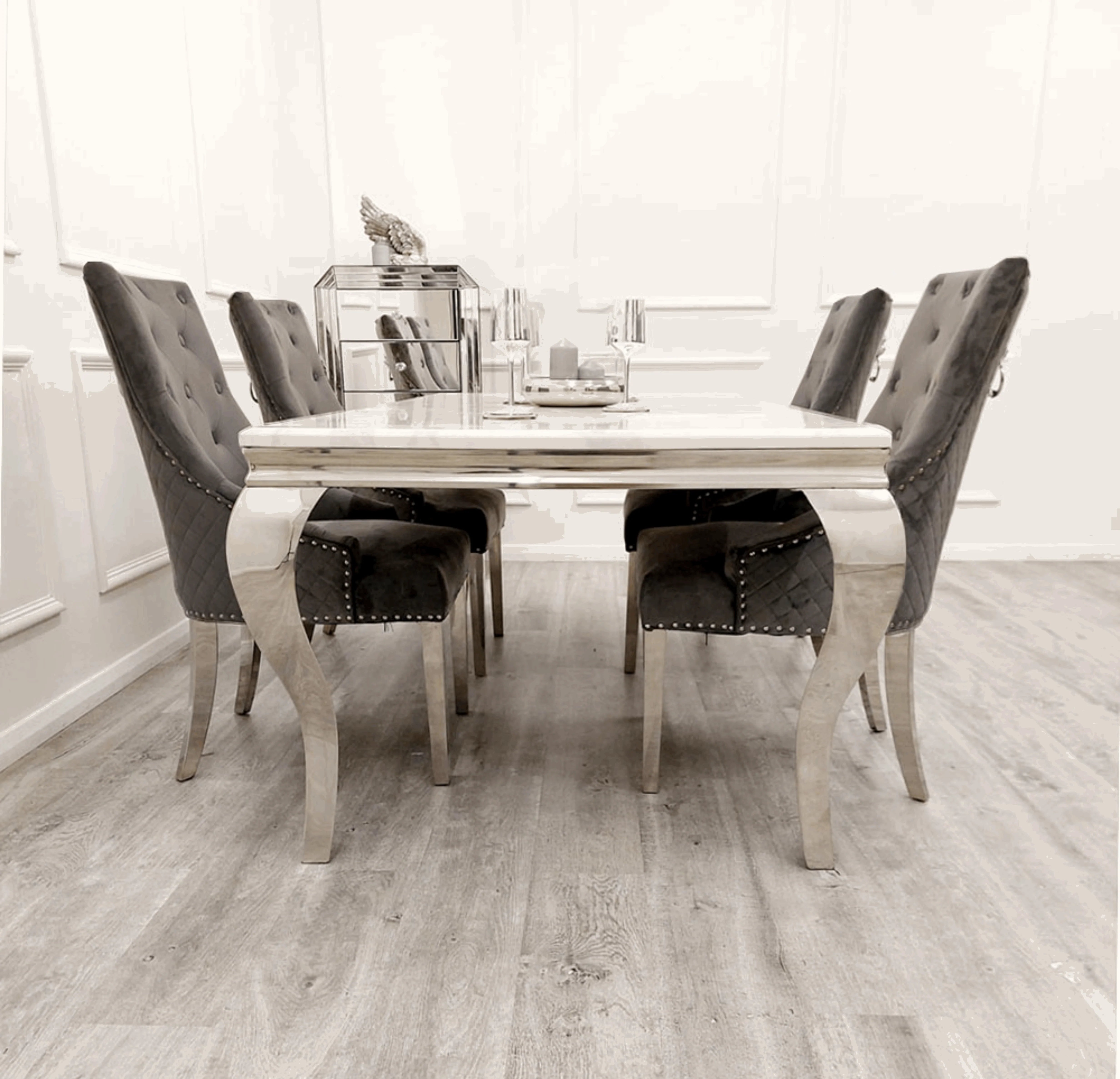 Side view of Louis Silver Grey marble effect dining set with grey velvet dining chairs from Solid Furniture UK
