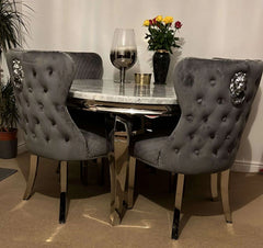 Close up detail of marble effect dining table top and velvet dining chairs Solid Furniture UK