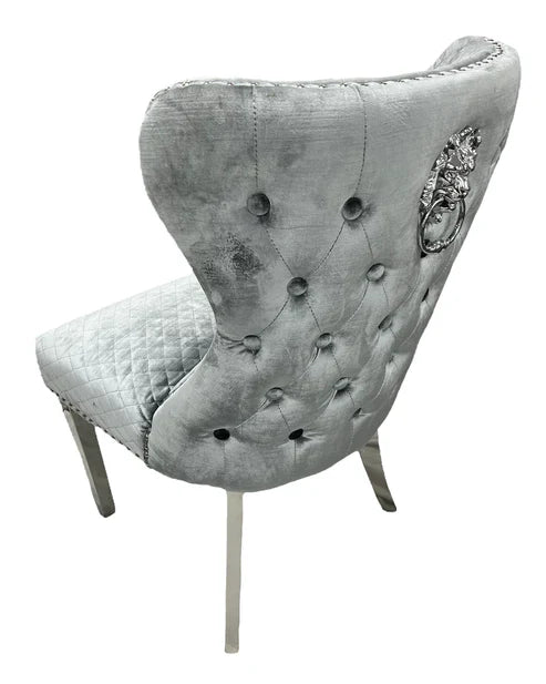 Louis velvet dining chair side view with lion knocker and chrome legs by Solid Furniture UK, modern dining chair UK