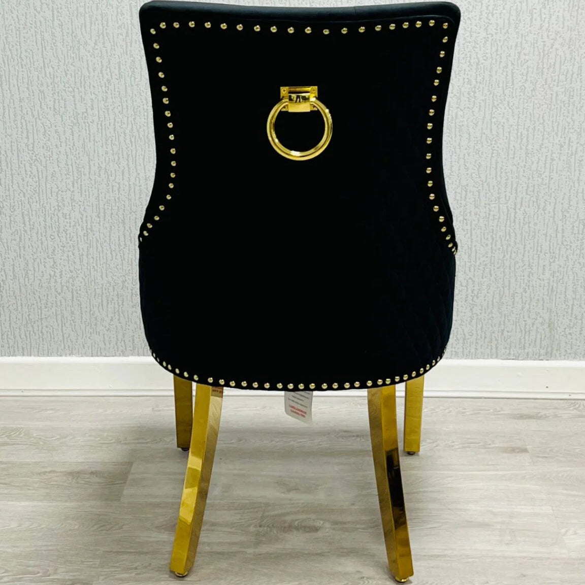 Back view of Majestic Black Gold dining chair showing high back support and elegant upholstery from Solid Furniture UK