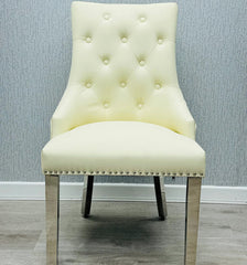 Majestic Cream PU Leather Dining Chair with Lion Knocker Detail Main View from Solid Furniture UK