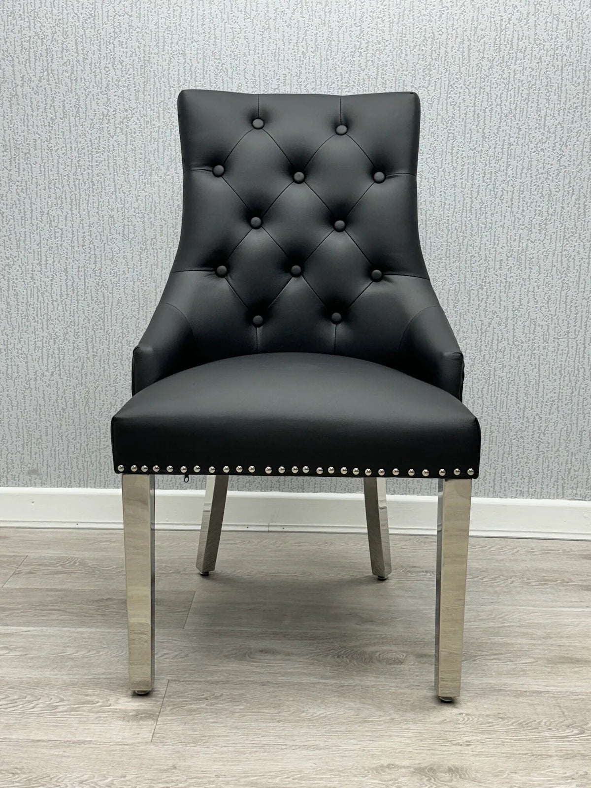 Majestic Midnight Black PU Leather Dining Chair with Lion Knocker Detail Main View from Solid Furniture UK