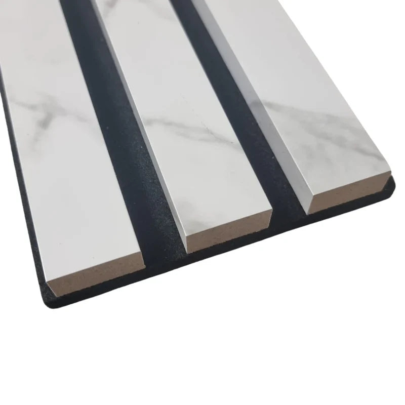 Close-up of marble-white slatted wall panel highlighting slim vertical slats, 2.5 cm width, 1.5 cm spacing, and durable HDF surface with acoustic felt backing. solid furniture UK