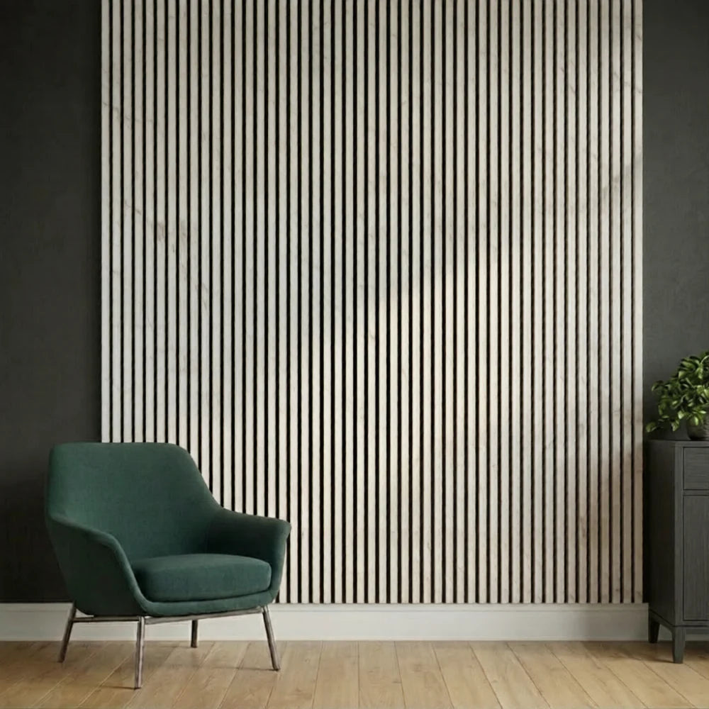 Marble-white slatted wall panels installed in a modern hallway, showing slim vertical slats, subtle marble-white finish, and acoustic functionality in a bright, minimalist space. solid furniture UK
