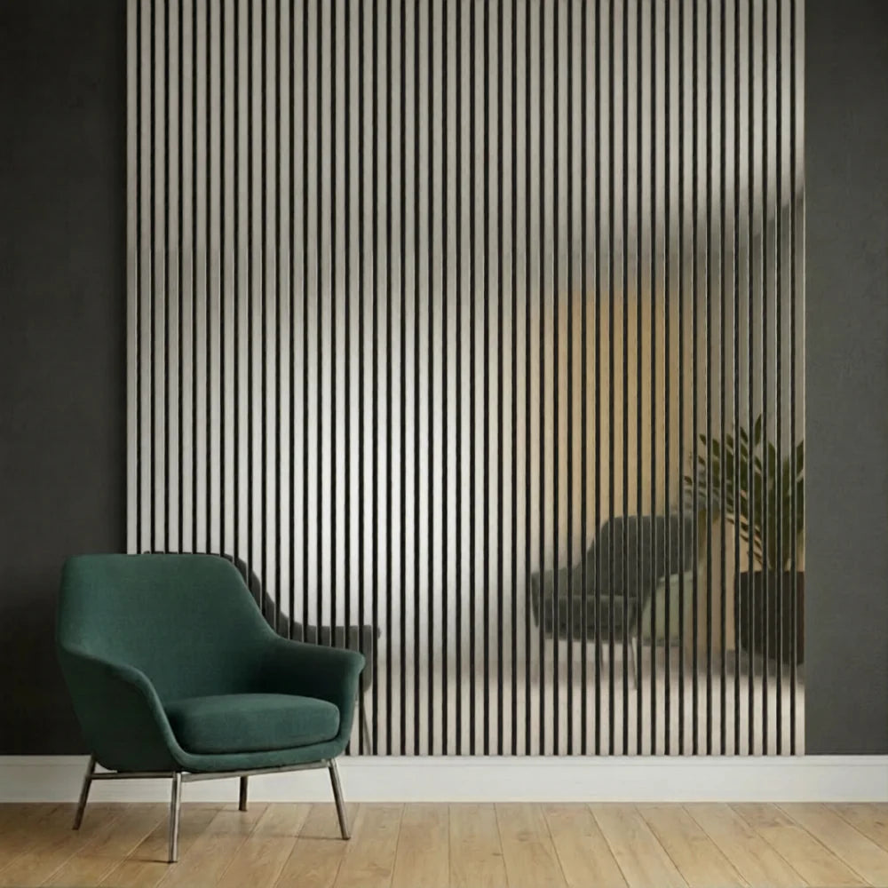 Metallic dark grey slatted wall panels installed in a modern living room showing sleek vertical slats, contemporary industrial style, and acoustic sound absorption. solid furniture UK