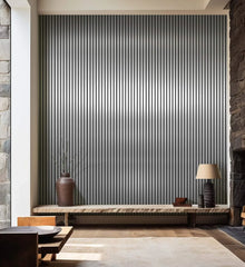 Metallic dark grey slatted wall panels installed on a modern living room wall, showing full wall coverage and sleek, contemporary design. solid furniture UK