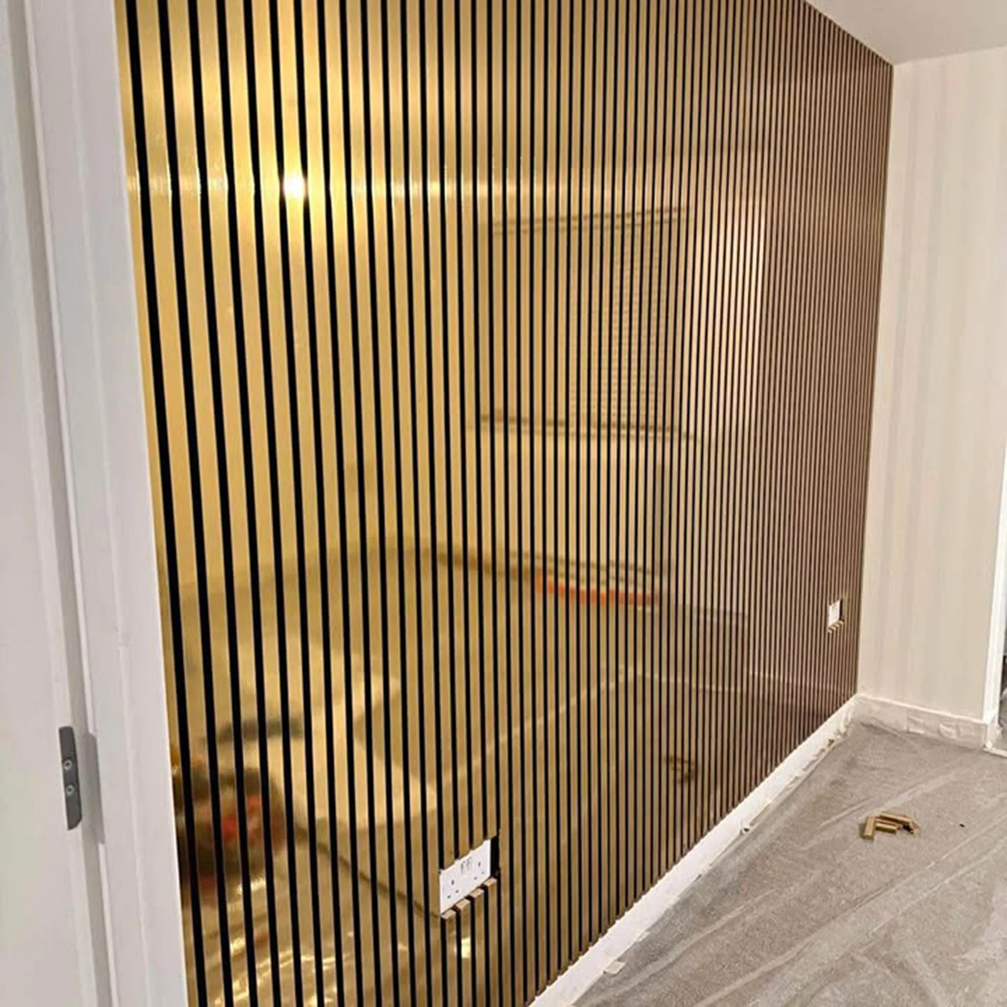 Side view of metallic gold wall panel 60x240cm UK showing panel thickness and slatted profile. solid furniture UK