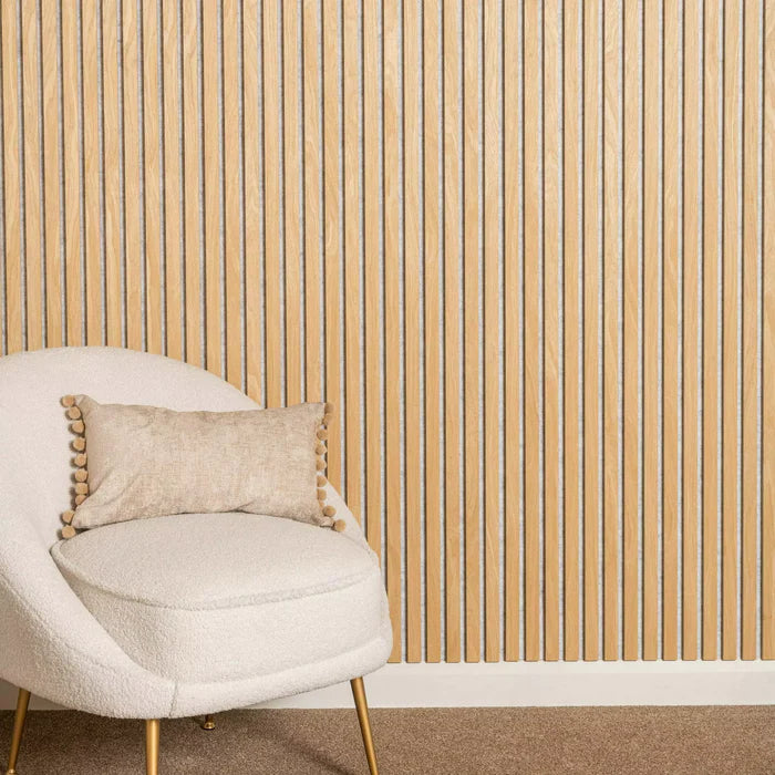 Modern living room featuring oak acoustic slatted wall panels installed as a feature wall, enhancing interior aesthetics and improving sound acoustics. solid furniture UK