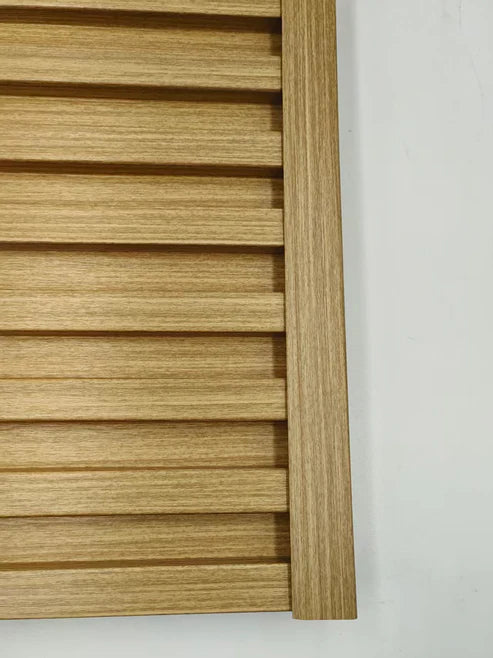 Installed oak wall panel end trim showing professional finishing on wall panels for bathrooms and feature walls by Solid Furniture UK.