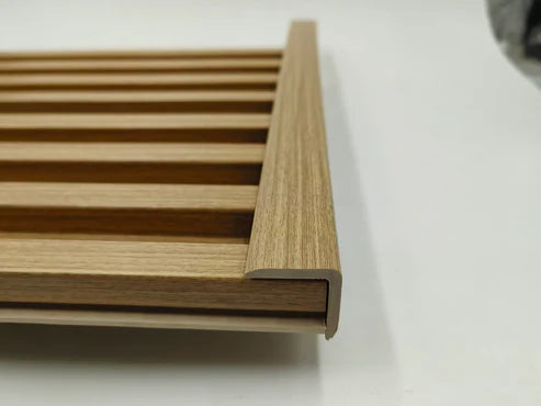 Oak wall panel end trim installed vertically on wall panels providing clean edge finishing for seamless interior design by Solid Furniture UK.