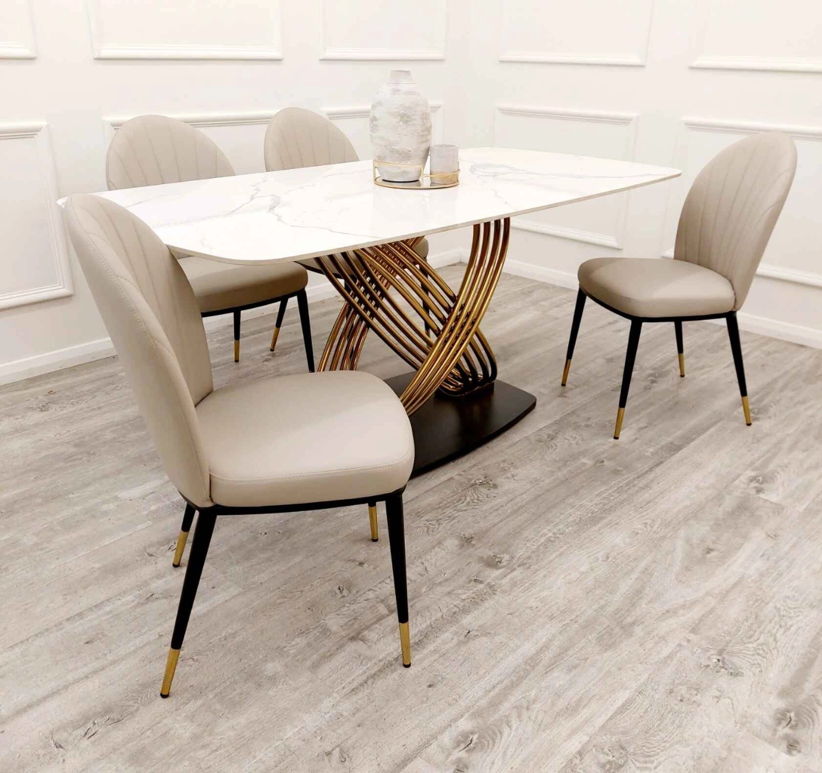 Orion Gold 1.8m dining table with Etta beige leather dining chairs side angle view at Solid Furniture UK