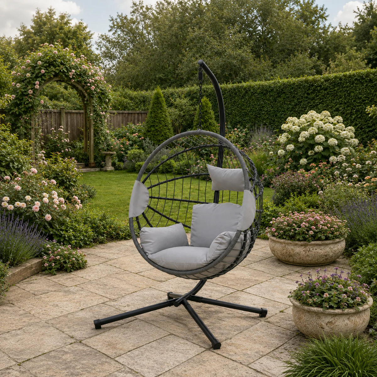 Outdoor hanging egg chair in light grey finish ideal for garden seating and leisure spaces solid furniture UK