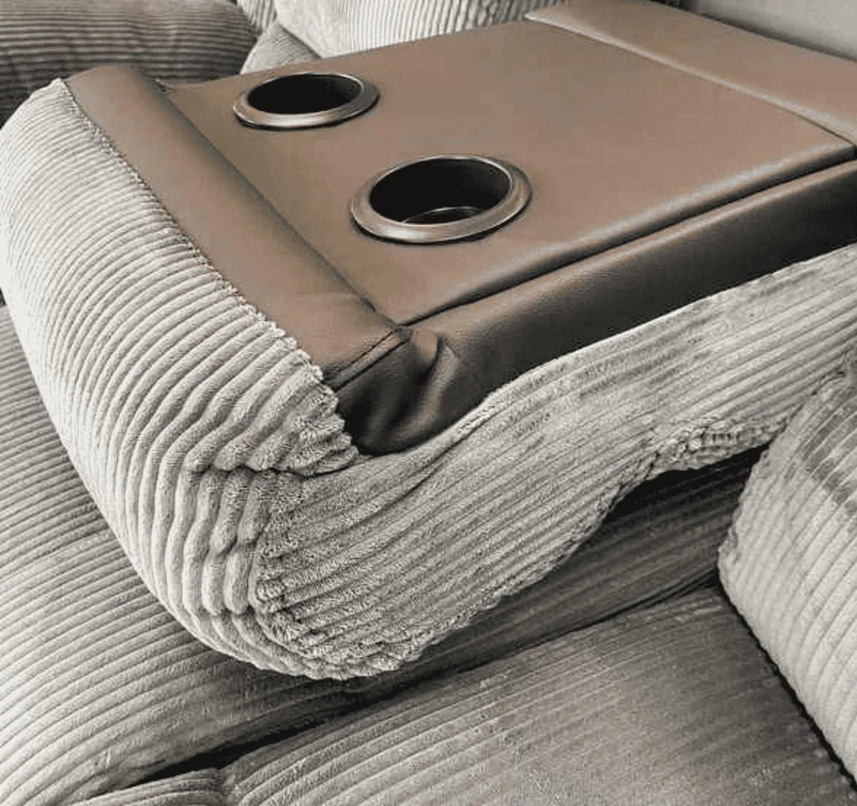 Close-up of Rio recliner sofa cup holder console showing built-in storage and drink holders SOLID FURNITURE LTD