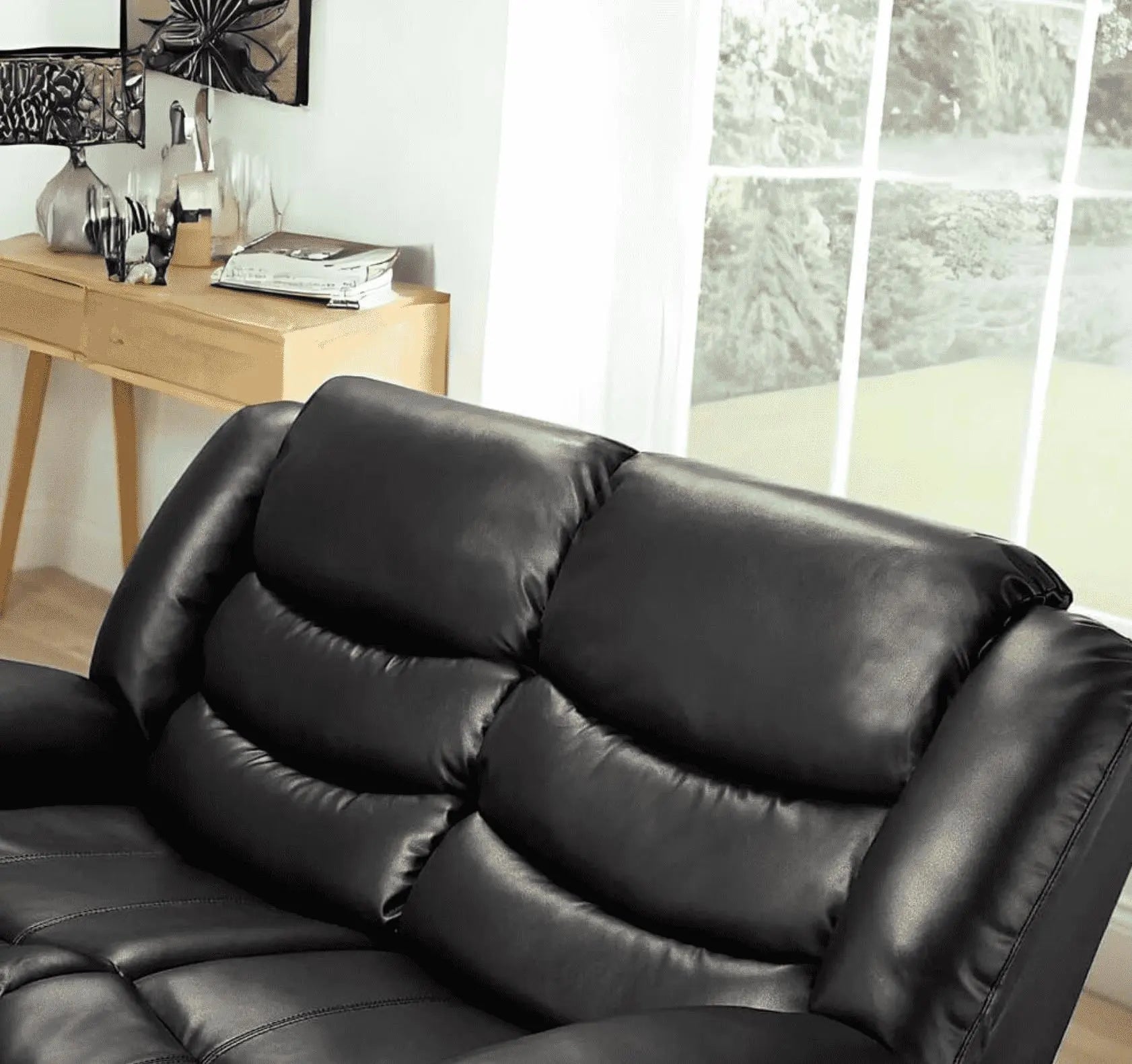 Close-up of Roma 2 seater black recliner sofa showing premium air leather upholstery and stitching detail solid furniture UK