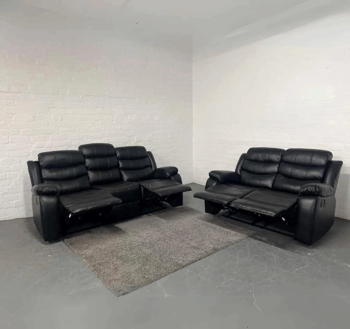 Front view of Roma 3+2 black recliner sofa set with stylish air leather finish and dual reclining seats solid furniture UK