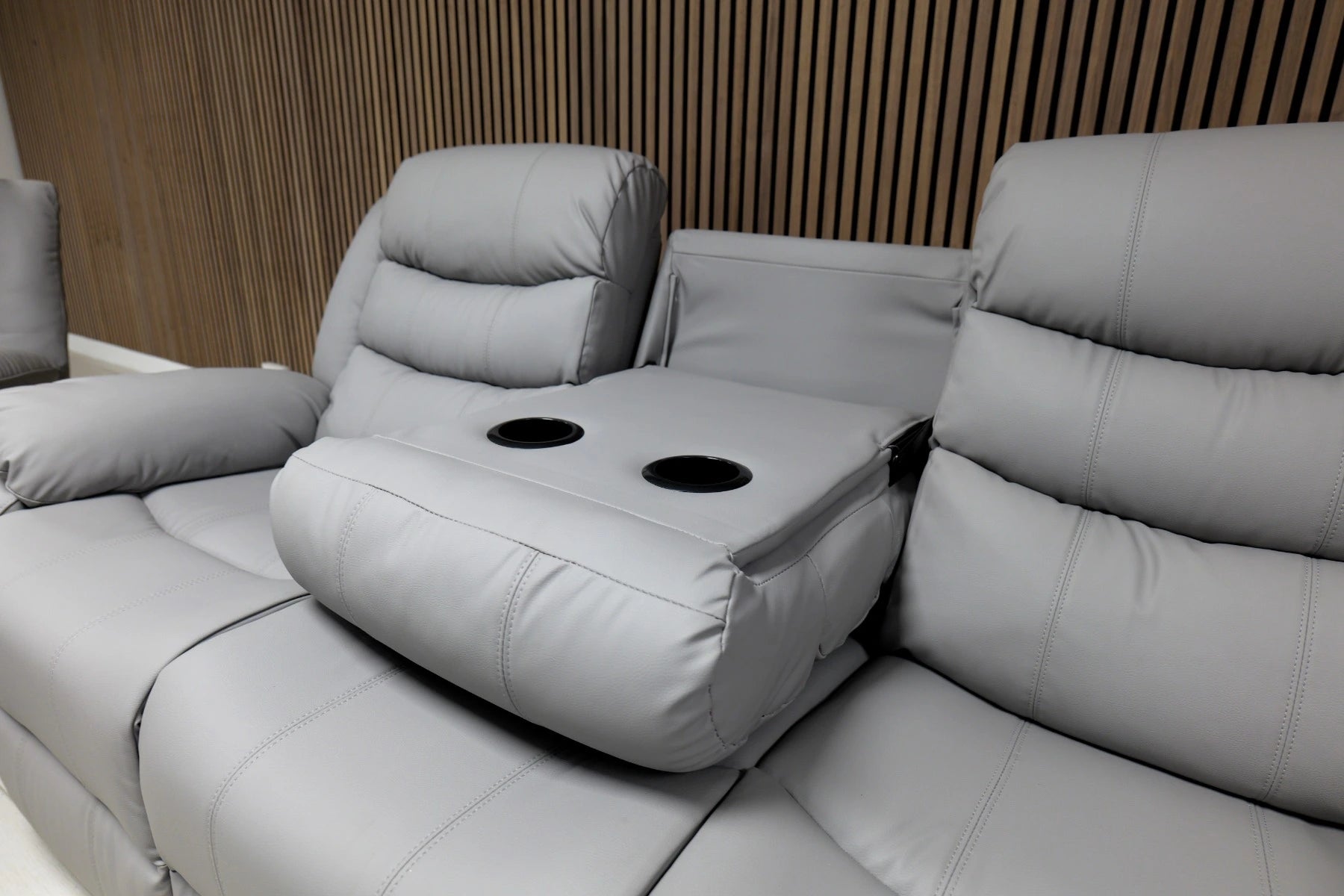 Roma light grey recliner sofa console view showing cup holders and storage features solid furniture UK