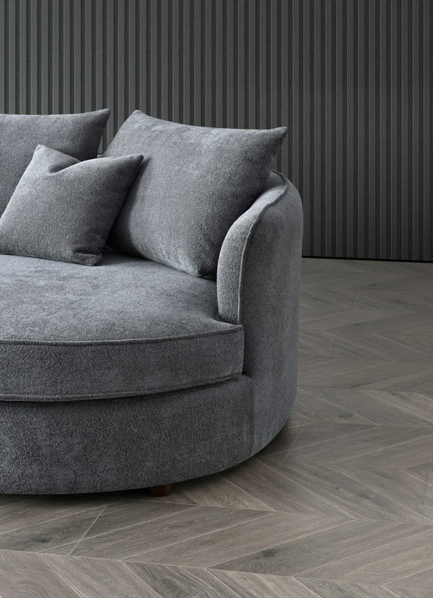 Right corner view of Rubin curved chaise sofa in Charcoal grey bouclé upholstery solid furniture UK