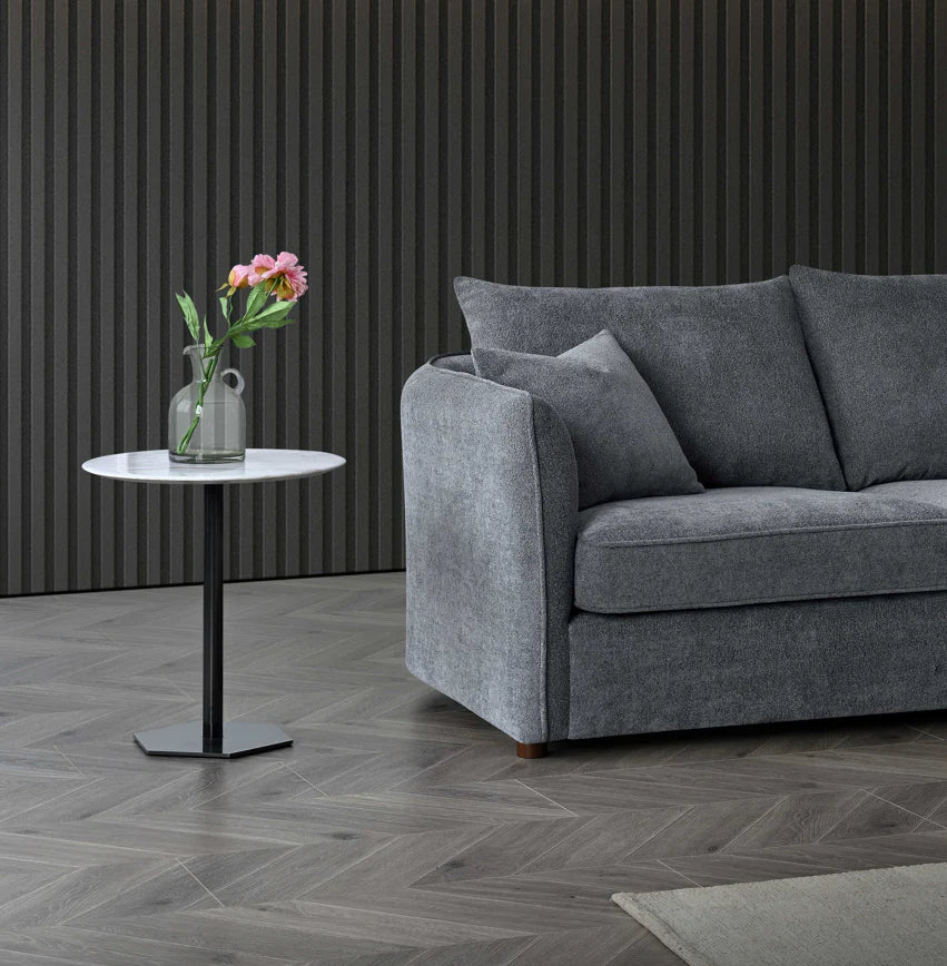 Side view of Rubin charcoal bouclé corner chaise sofa showing sculpted shape solid furniture UK