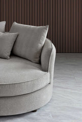 Right corner view of Rubin curved chaise sofa in pebble grey bouclé upholstery solid furniture UK