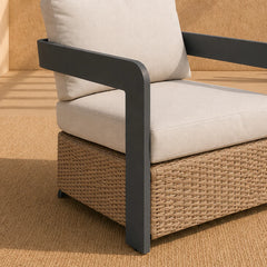 Close-up view of Selene wicker outdoor armchair featuring grey aluminium frame, weather-resistant polyrattan weave, and deep cushioned seating designed for modern garden and patio comfort solid furniture UK