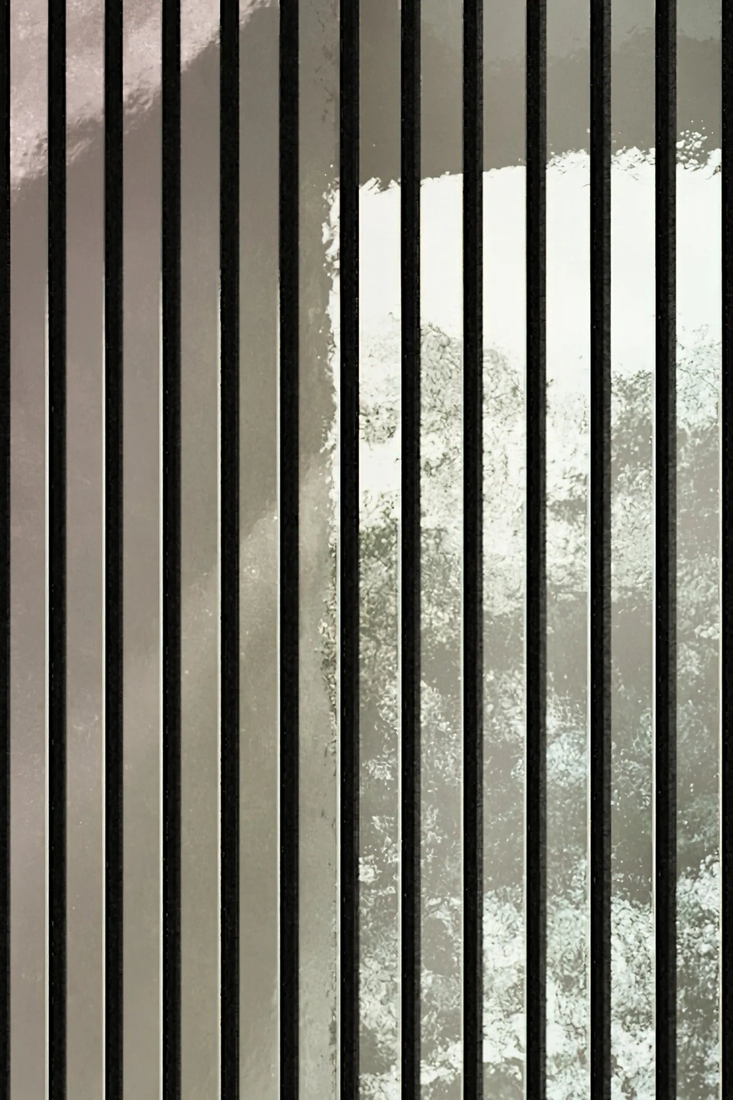 Close-up of shiny silver wall panels 60x240 by Solid Furniture UK highlighting HDF slats, spacing, and polished metallic surface