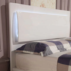 Solid Furniture UK Slim LED high gloss white ottoman storage bed frame with integrated LED lighting on the headboard