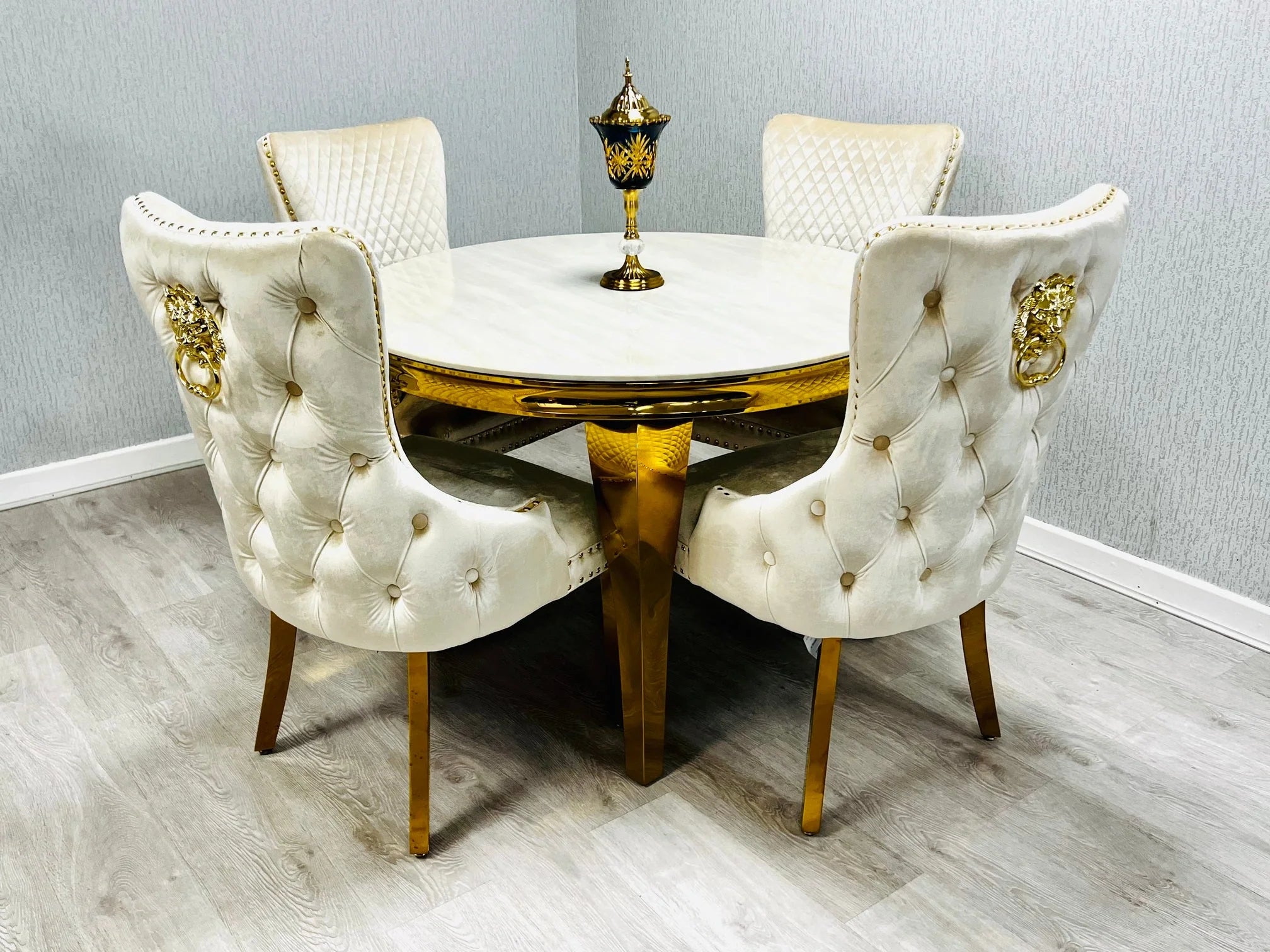 1.3m round Sofia Gold Marble Dining Table in cream finish with upholstered dining chairs set in modern dining room solid furniture UK