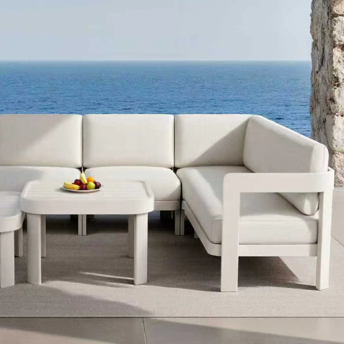 Corner view of Sofia 8 seater lounge set with tables in a UK outdoor garden setting from Solid Furniture UK