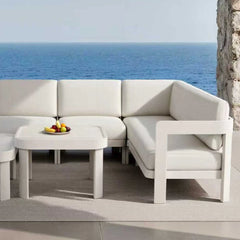 Corner view of Sofia 8 seater lounge set with tables in a UK outdoor garden setting from Solid Furniture UK