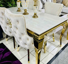 White marble Sofia Gold Dining Table with gold base and upholstered dining chairs in elegant modern interior solid furniture UK