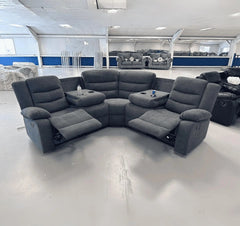 Front view of Sorrento grey fabric recliner sofa showing cushioned seats and armrests solid furniture UK