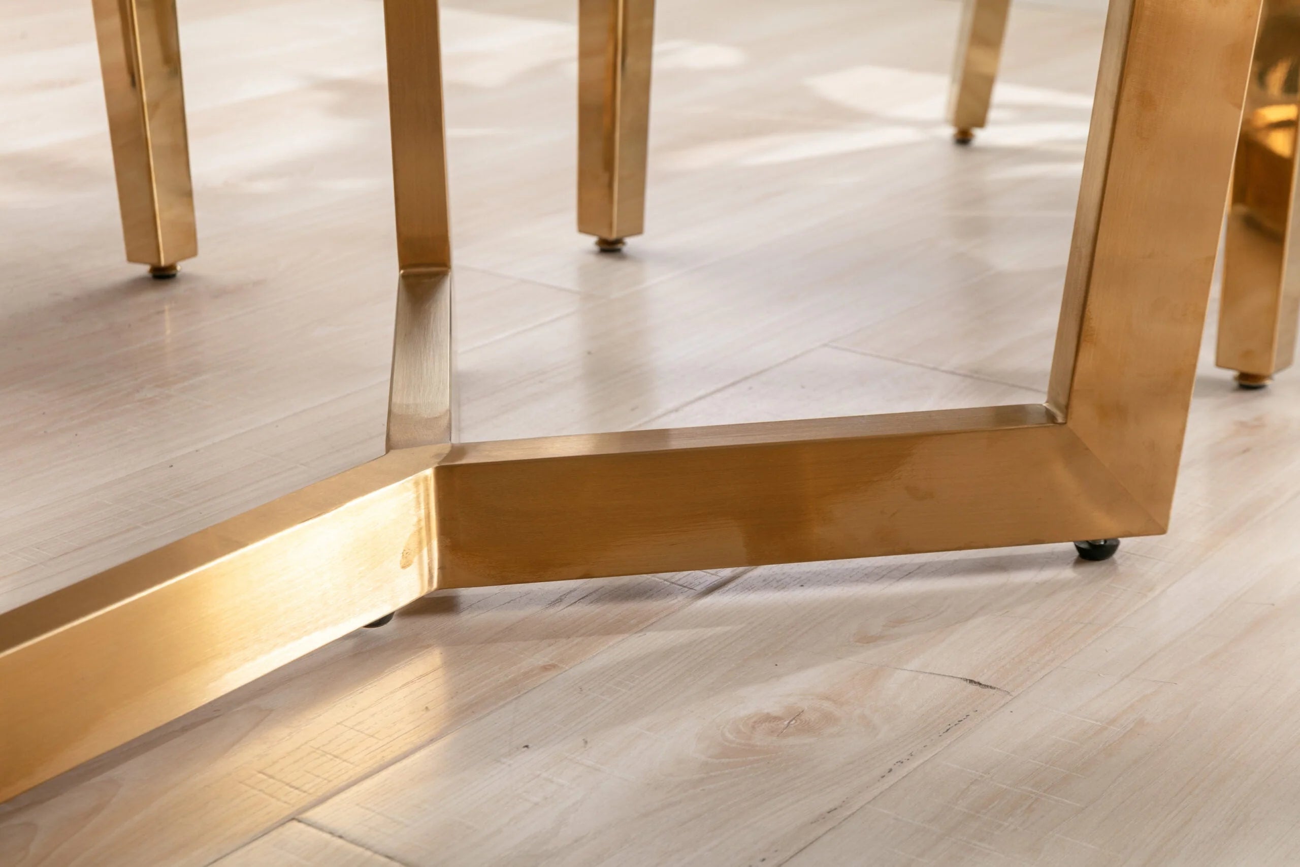 Sorrento dining table gold pedestal base detail modern luxury furniture Solid Furniture UK