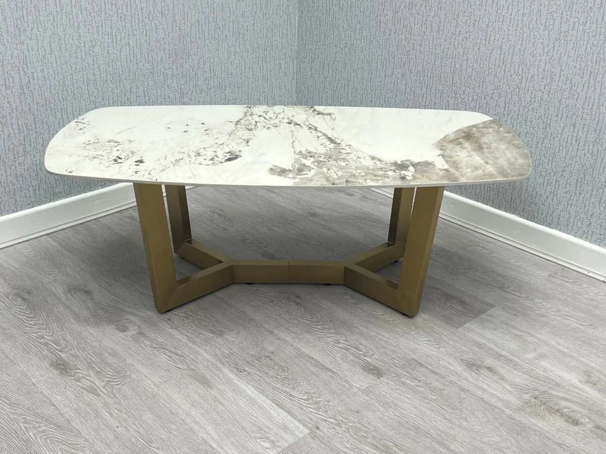 Sorrento oval coffee table with cream and gold ceramic top and gold frame main view | Solid Furniture UK