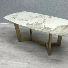 Sorrento oval coffee table side view with cream and gold ceramic top and gold frame | Solid Furniture UK