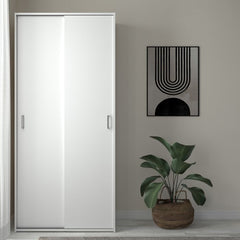 Space 2 Sliding Doors Wardrobe in a stylish UK bedroom, minimalist white wardrobe for small rooms