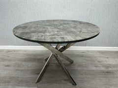 Tokyo round dining table with a grey stone effect glass top and contemporary design from Solid Furniture UK.