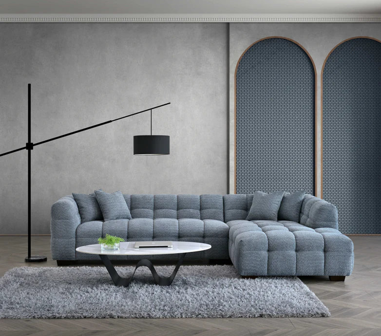 Front view of the Tribeca Corner Group modern iron bouclé corner sofa with chaise and footstool, showing clean lines and spacious seating solid furniture UK