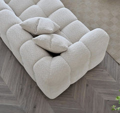 Angled corner view of Tribeca RHF corner sofa in oatmeal bouclé highlighting spacious seating - SOLID FURNITURE LTD